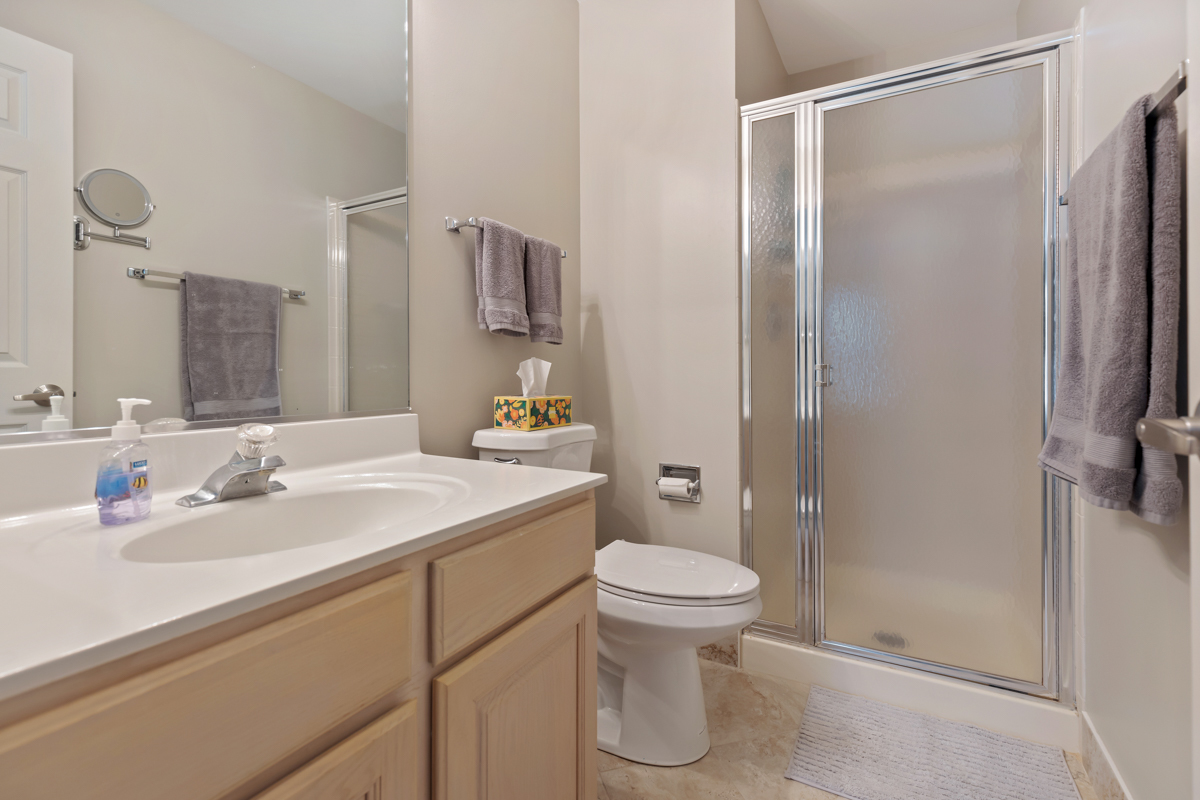 320 Crestview Drive, Unit B Wauconda, IL 60084 - Photo 20 of 28 a bathroom with a sink toilet and shower