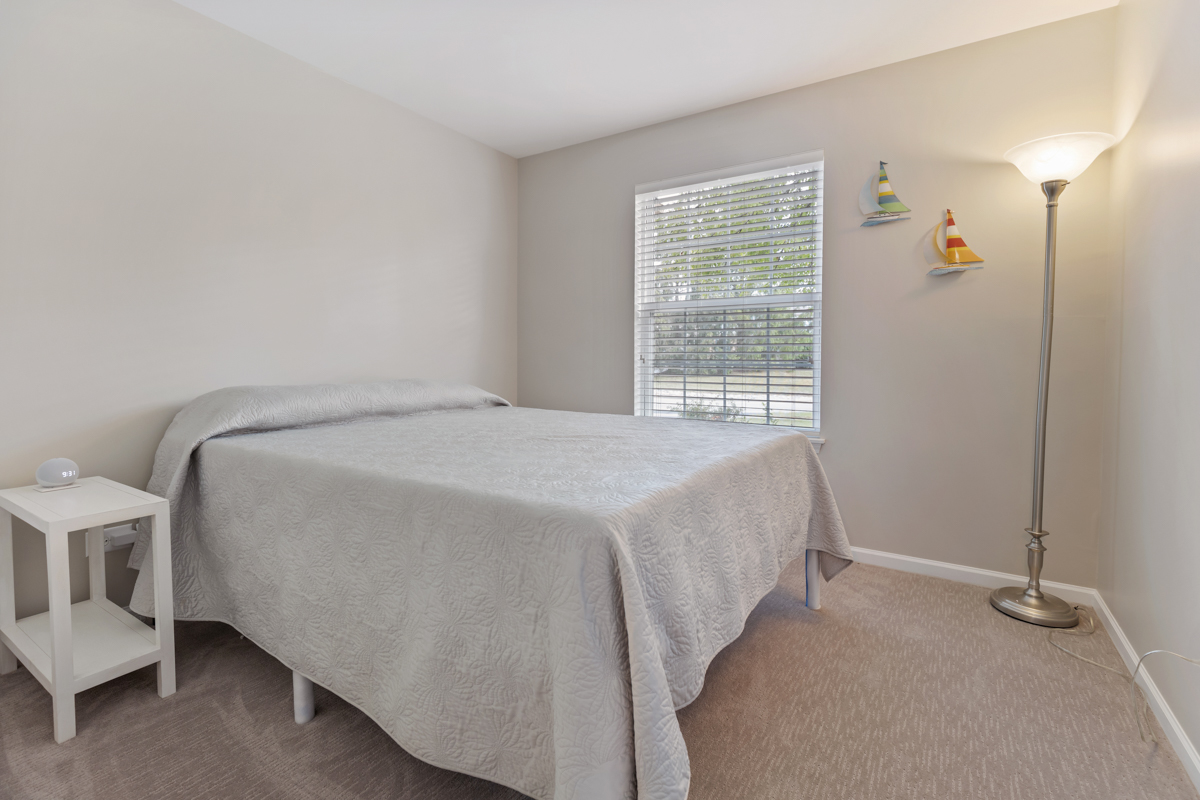 320 Crestview Drive, Unit B Wauconda, IL 60084 - Photo 22 of 28 a spacious bedroom with a bed and a window