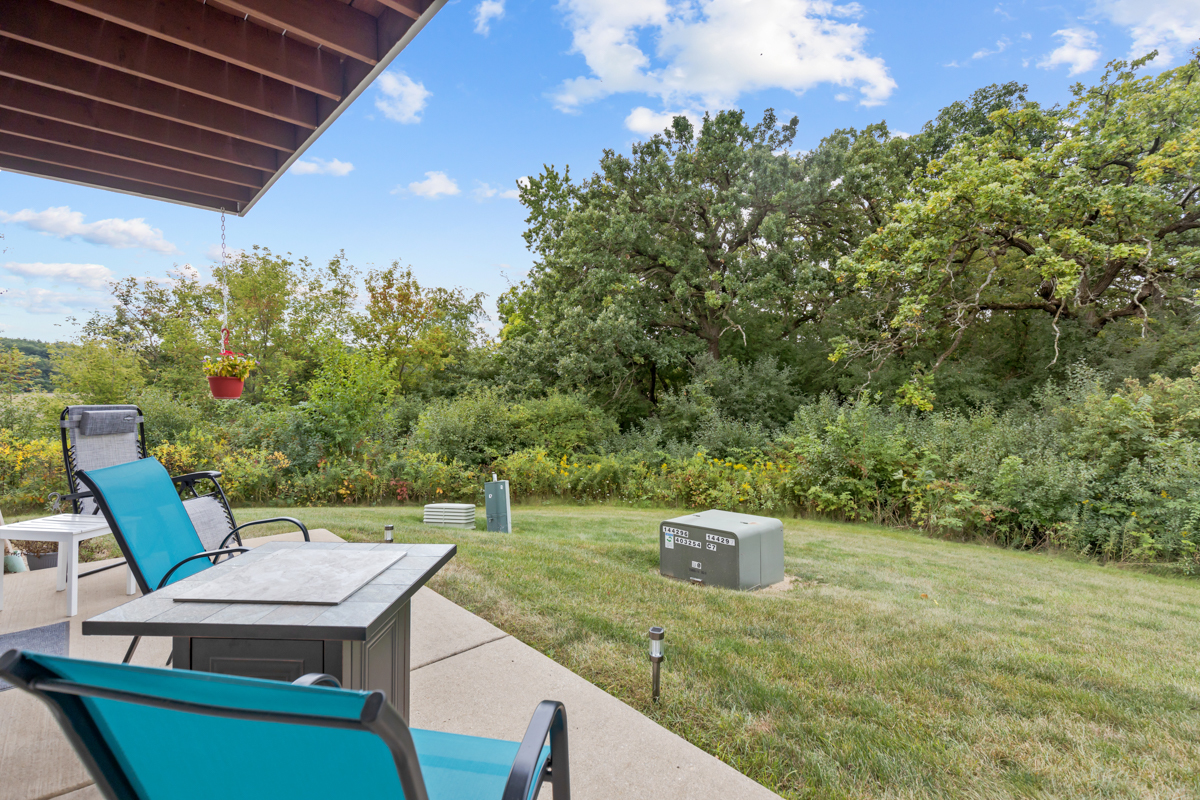 320 Crestview Drive, Unit B Wauconda, IL 60084 - Photo 28 of 28 a view of a chairs and table in a patio