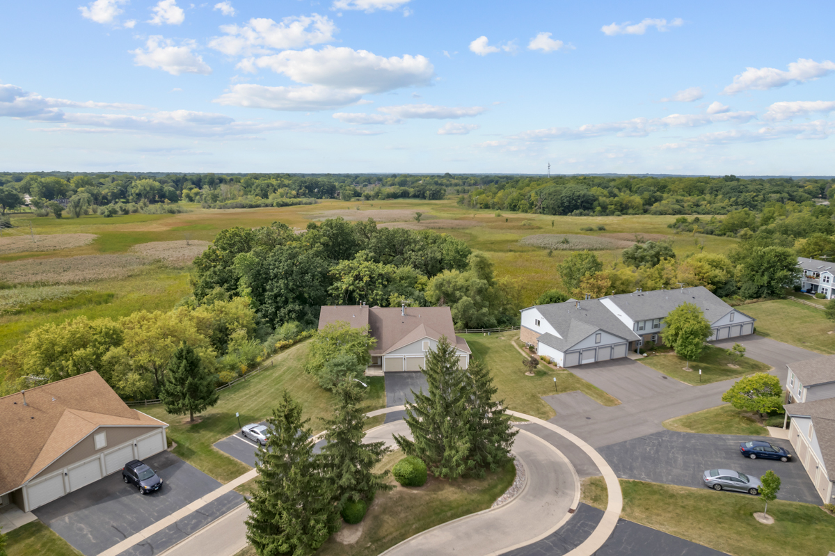320 Crestview Drive, Unit B Wauconda, IL 60084 - Photo 3 of 28 a view of a lake with a yard