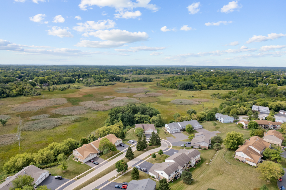 320 Crestview Drive, Unit B Wauconda, IL 60084 - Photo 4 of 28 an aerial view of a city with lots of residential buildings