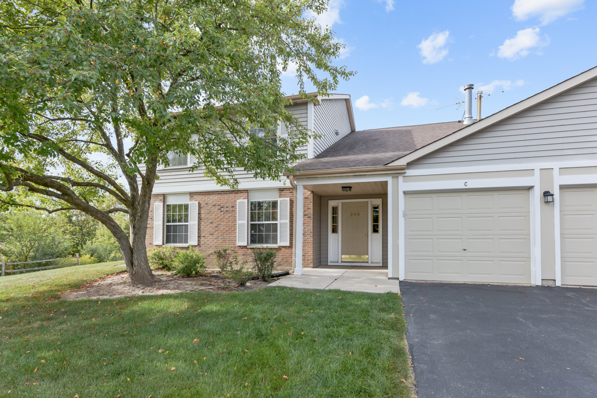 320 Crestview Drive, Unit B Wauconda, IL 60084 - Photo 9 of 28 a view of a house with a garden