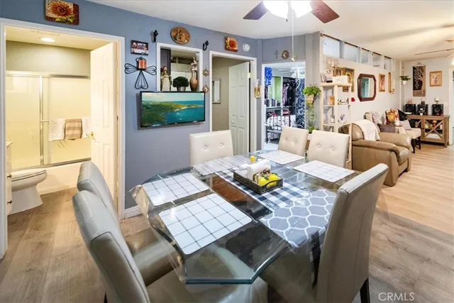 a view of a dining room with furniture and a livingroom