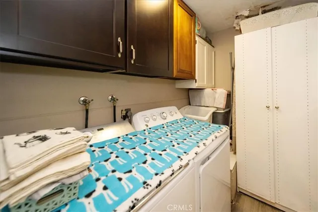 a bedroom with a bed and a cabinets