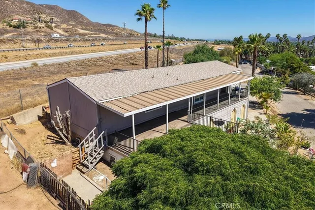 aerial view of a house with a ocean view