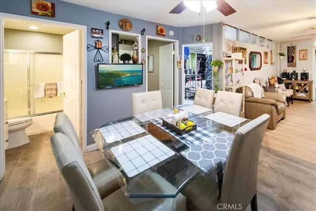 a view of a dining room with furniture and a livingroom