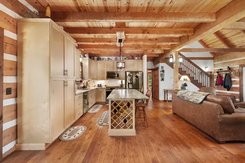 a bed room with a bed and a large window