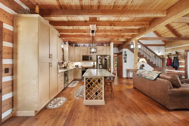 a bed room with a bed and a large window