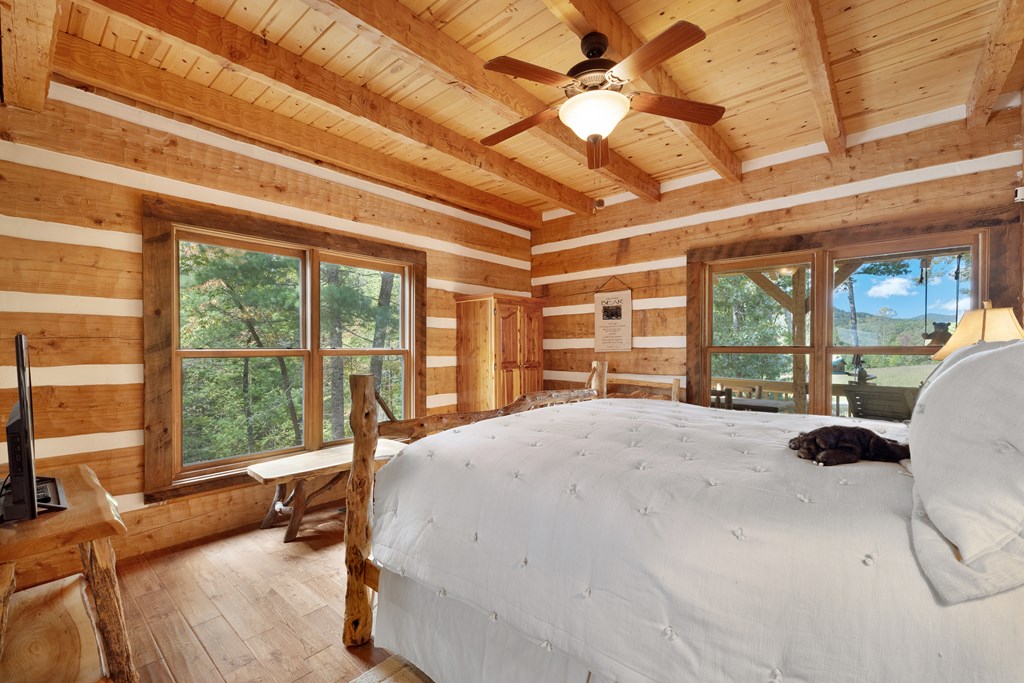 179 Cessna Loop Blue Ridge, GA 30513 - Photo 12 of 57 a bed room with a bed and a large window