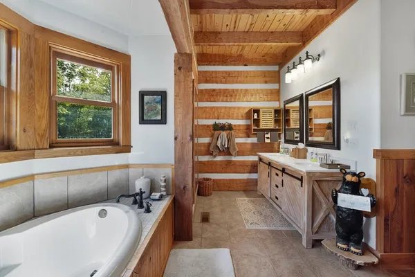 a view of a street with a large trees