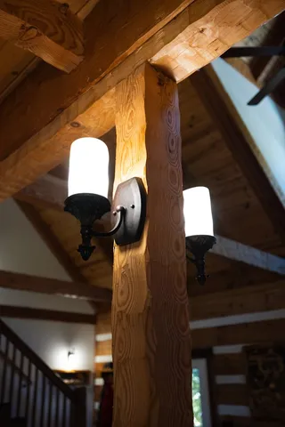 a bedroom with a bed next to a window