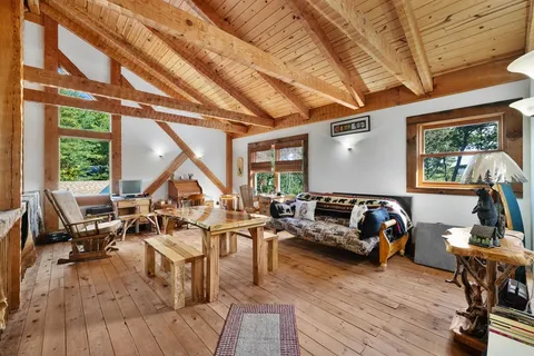 a bathroom with a shower sink and mirror