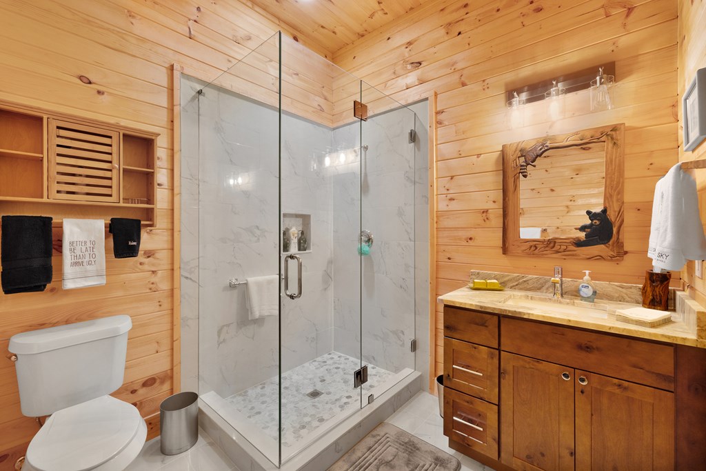 179 Cessna Loop Blue Ridge, GA 30513 - Photo 29 of 57 a bathroom with a shower sink and mirror