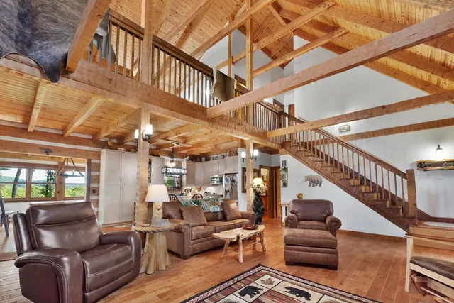 a kitchen with stainless steel appliances granite countertop sink stove top oven and cabinets