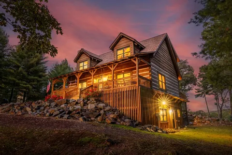 a bedroom with a bed and a ceiling fan