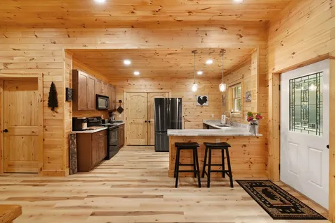 a bathroom with a double vanity sink toilet and shower