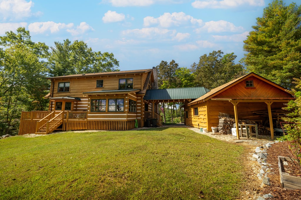 179 Cessna Loop Blue Ridge, GA 30513 - Photo 44 of 57 a view of a house with a big yard and large trees