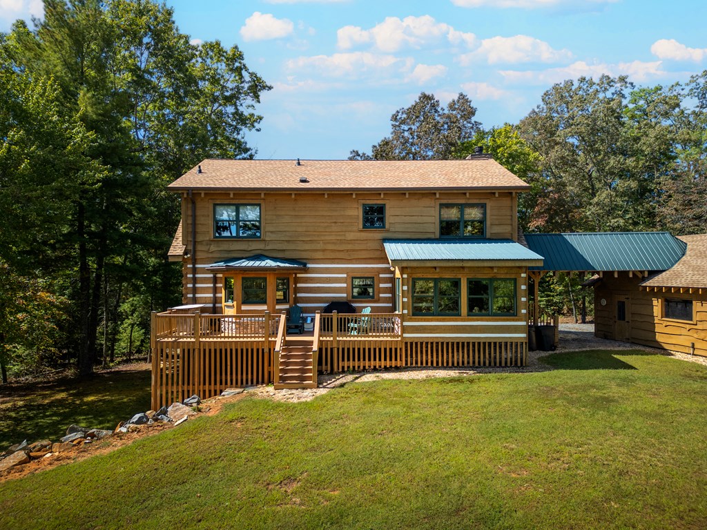 179 Cessna Loop Blue Ridge, GA 30513 - Photo 49 of 57 a front view of a house with a yard table and chairs
