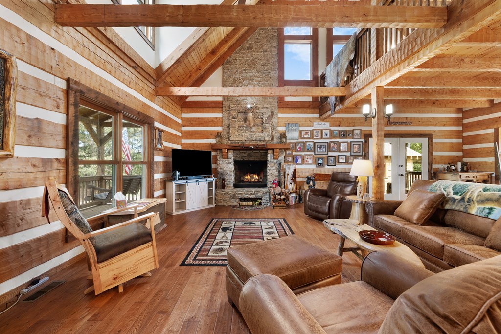179 Cessna Loop Blue Ridge, GA 30513 - Photo 5 of 57 a living room with furniture fireplace and flat screen tv