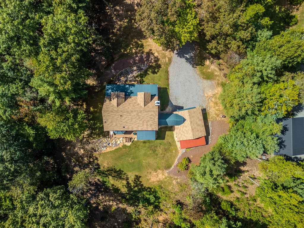 179 Cessna Loop Blue Ridge, GA 30513 - Photo 55 of 57 an aerial view of a house with outdoor space and trees all around