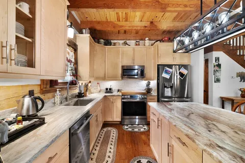 a bathroom with a sink and mirror with toilet