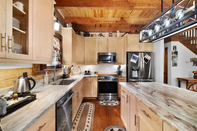 a bathroom with a sink and mirror with toilet