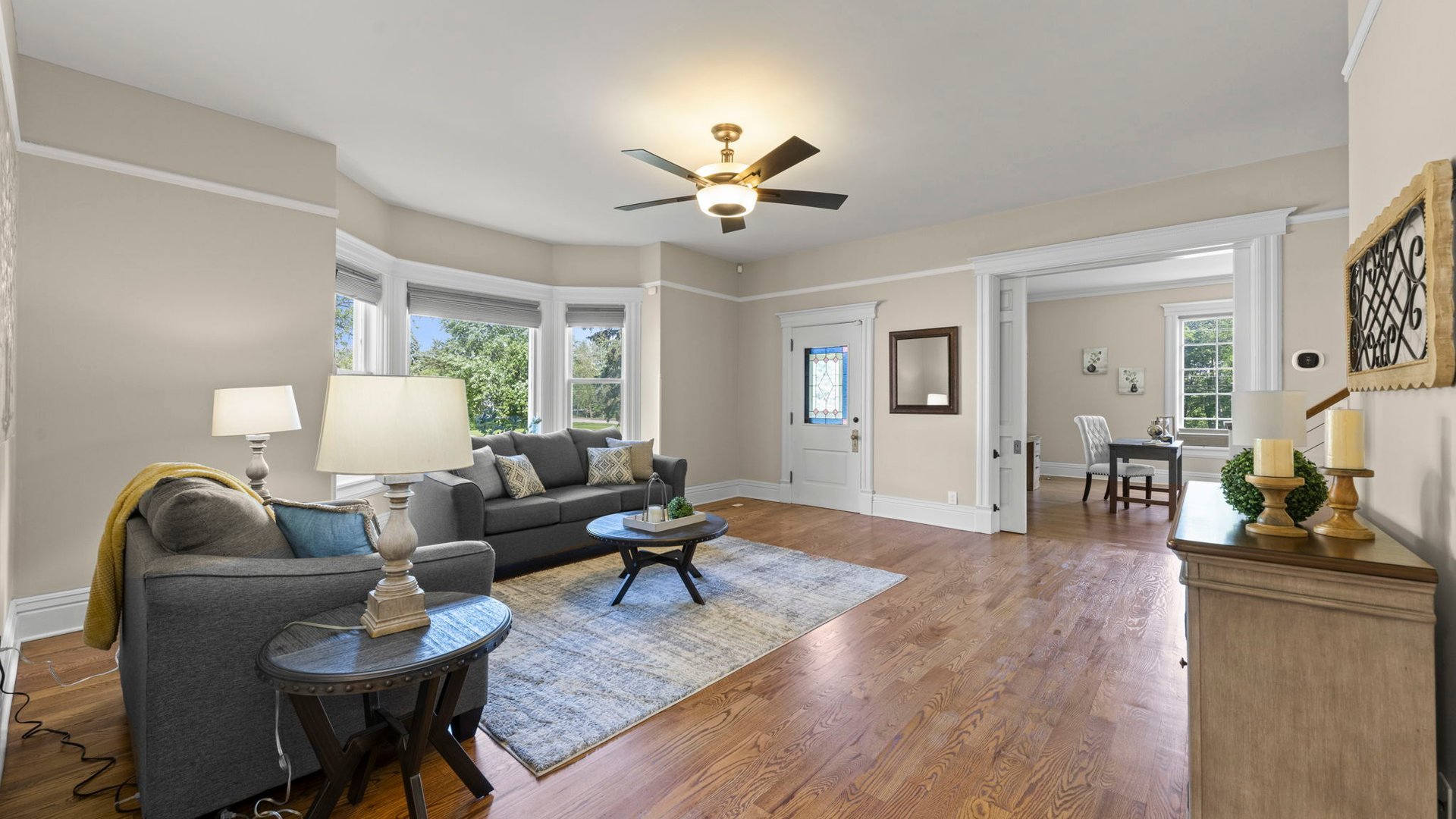 3614 Wolf Road Oswego, IL 60543 - Photo 10 of 56 a living room with furniture and a wooden floor