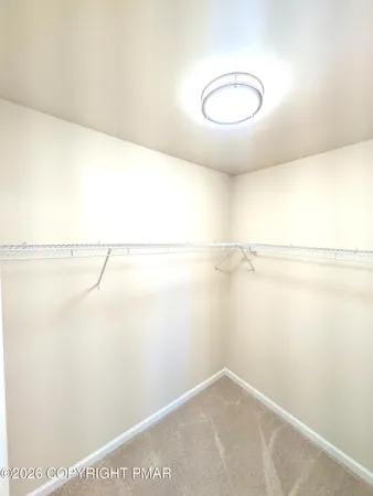 a bathroom with a double vanity sink toilet and a tub