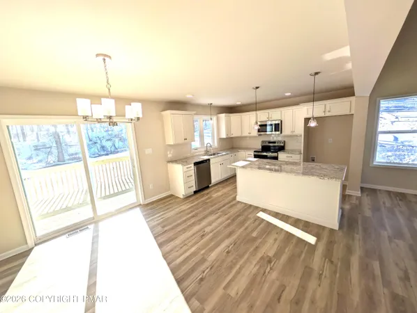 a view of a room with wooden floor and walls