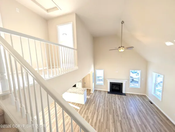 a large kitchen with stainless steel appliances kitchen island granite countertop a sink and cabinets