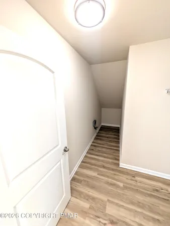 a bathroom with a toilet a sink and a mirror