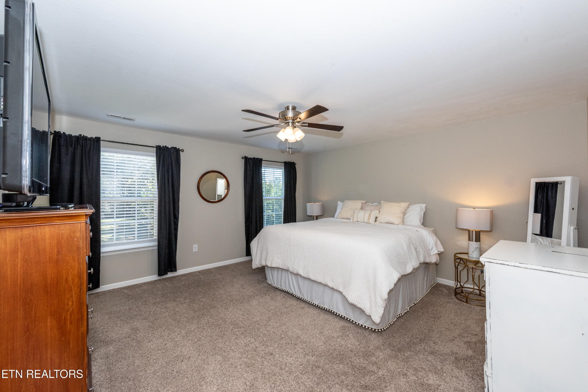 1600 Legacy Park Road Knoxville, TN 37922 - Photo 28 of 58 a bedroom with a bed and a chandelier