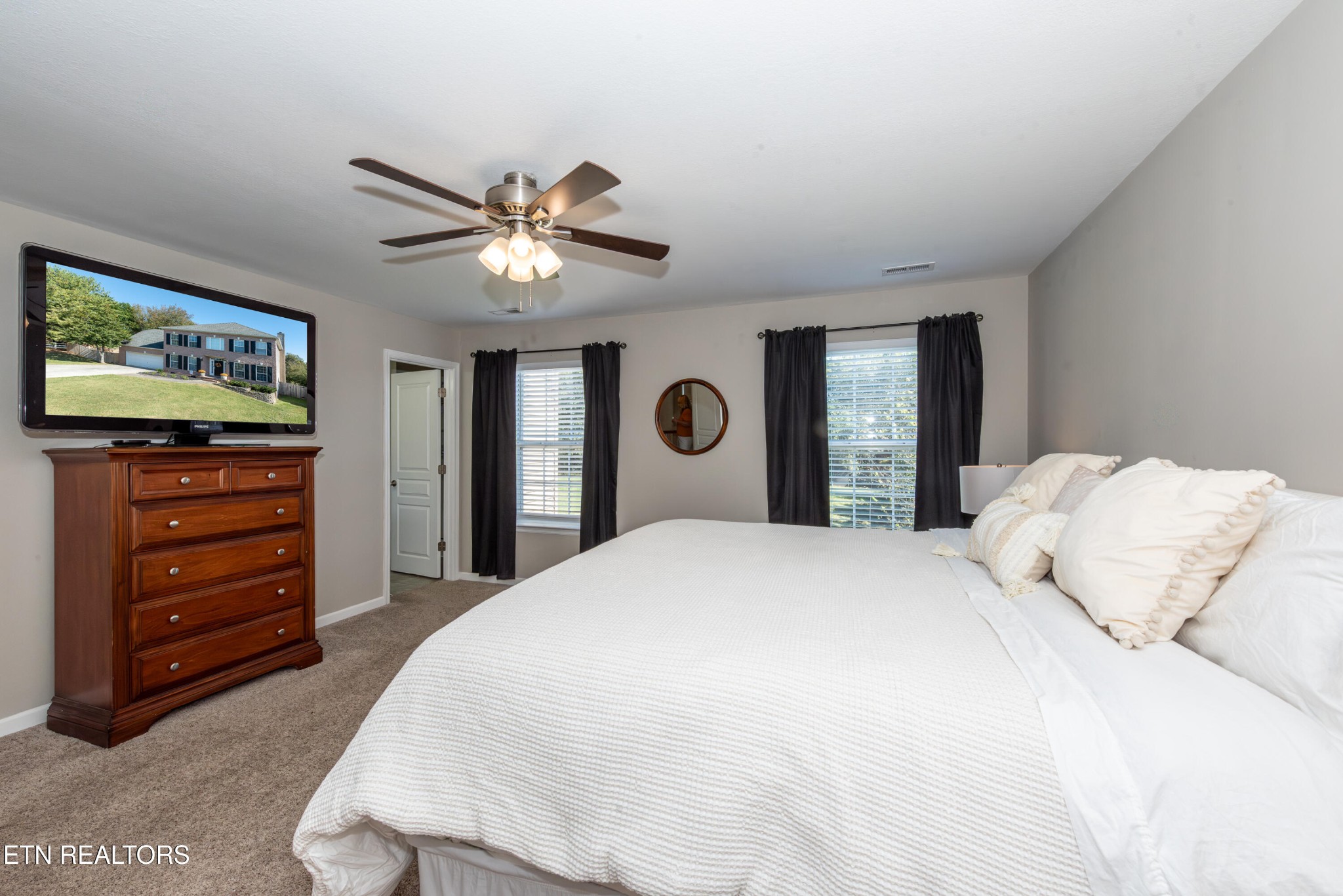 1600 Legacy Park Road Knoxville, TN 37922 - Photo 29 of 58 a bedroom with a bed and a dresser with a bookshelf