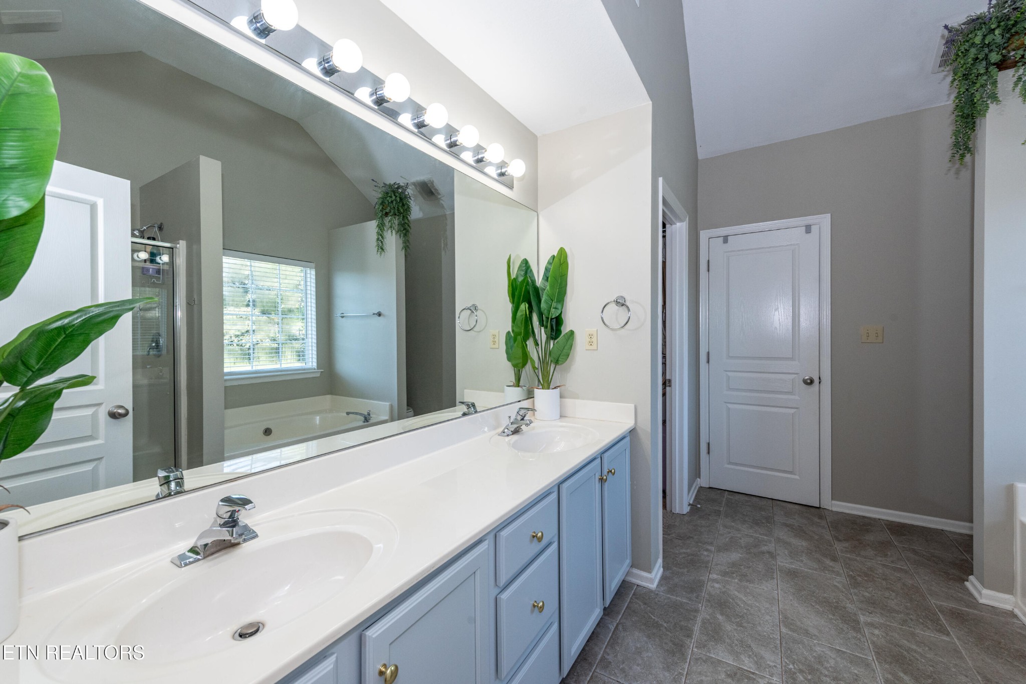 1600 Legacy Park Road Knoxville, TN 37922 - Photo 30 of 58 a spacious bathroom with a double vanity sink and a mirror