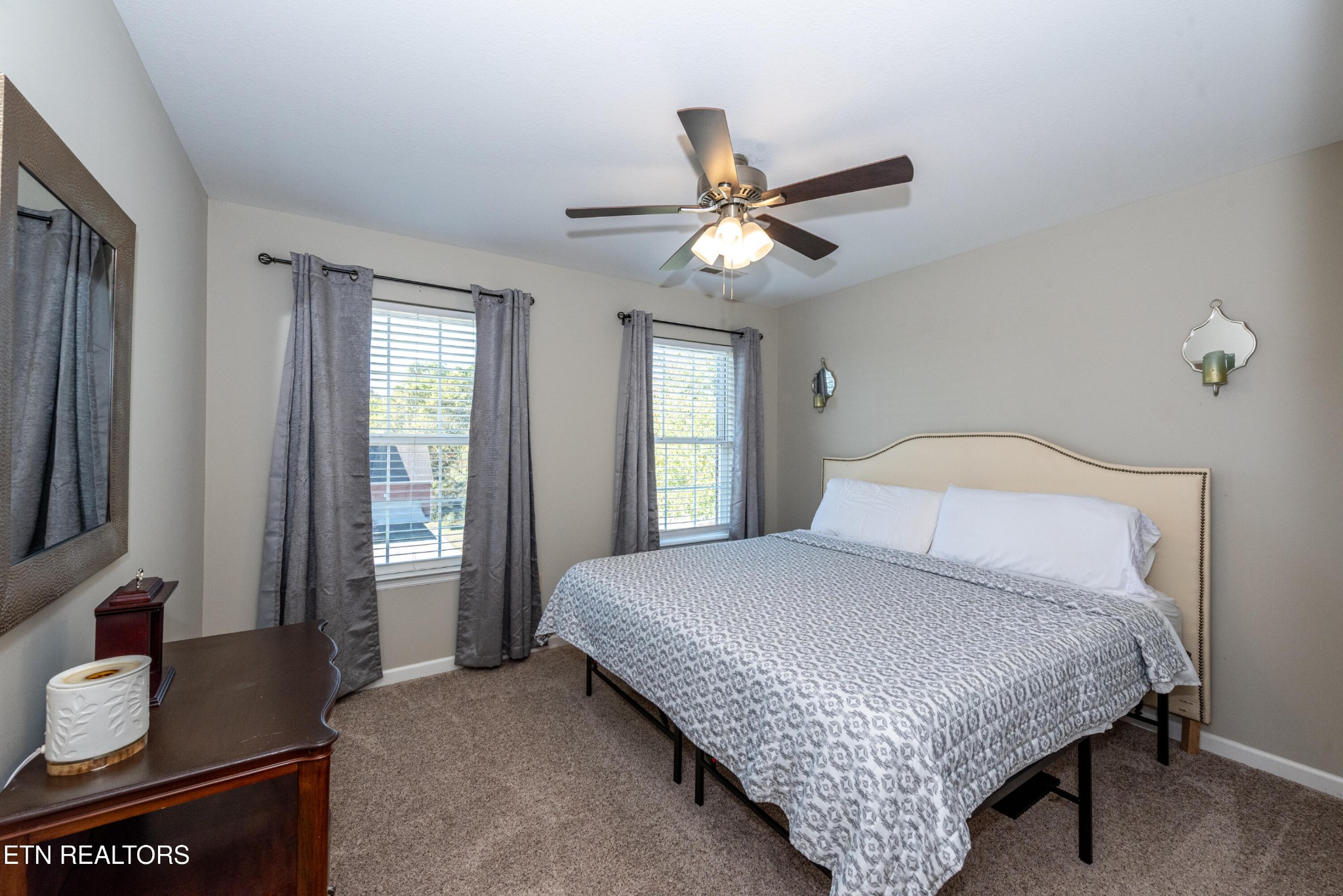 1600 Legacy Park Road Knoxville, TN 37922 - Photo 36 of 58 a bedroom with a bed and a chandelier