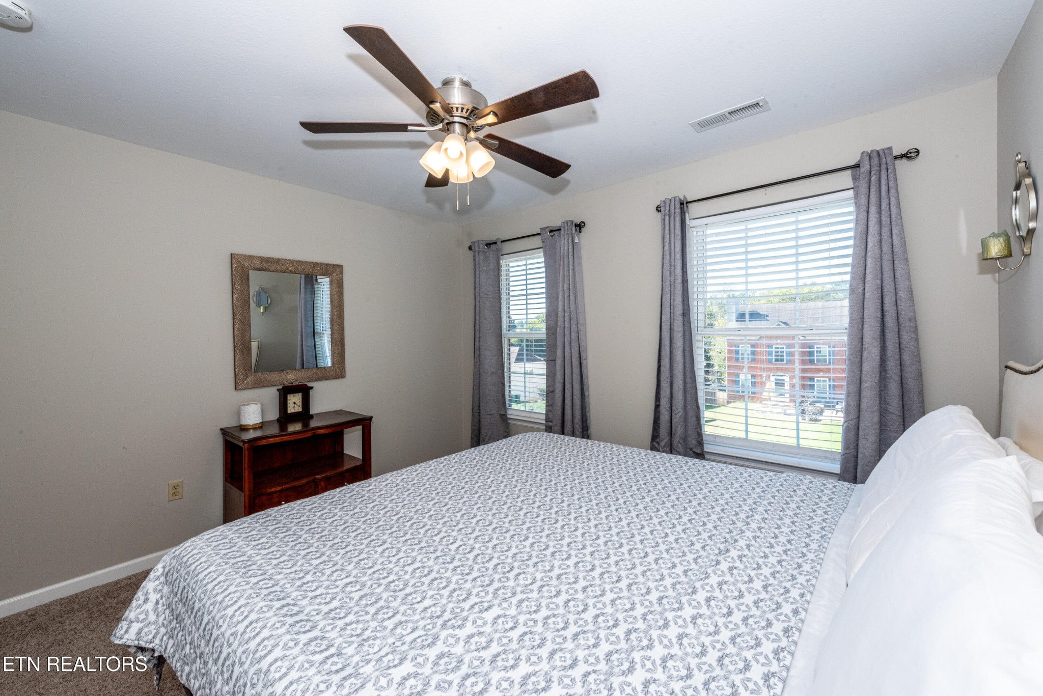 1600 Legacy Park Road Knoxville, TN 37922 - Photo 37 of 58 a bedroom with a large bed and a chandelier
