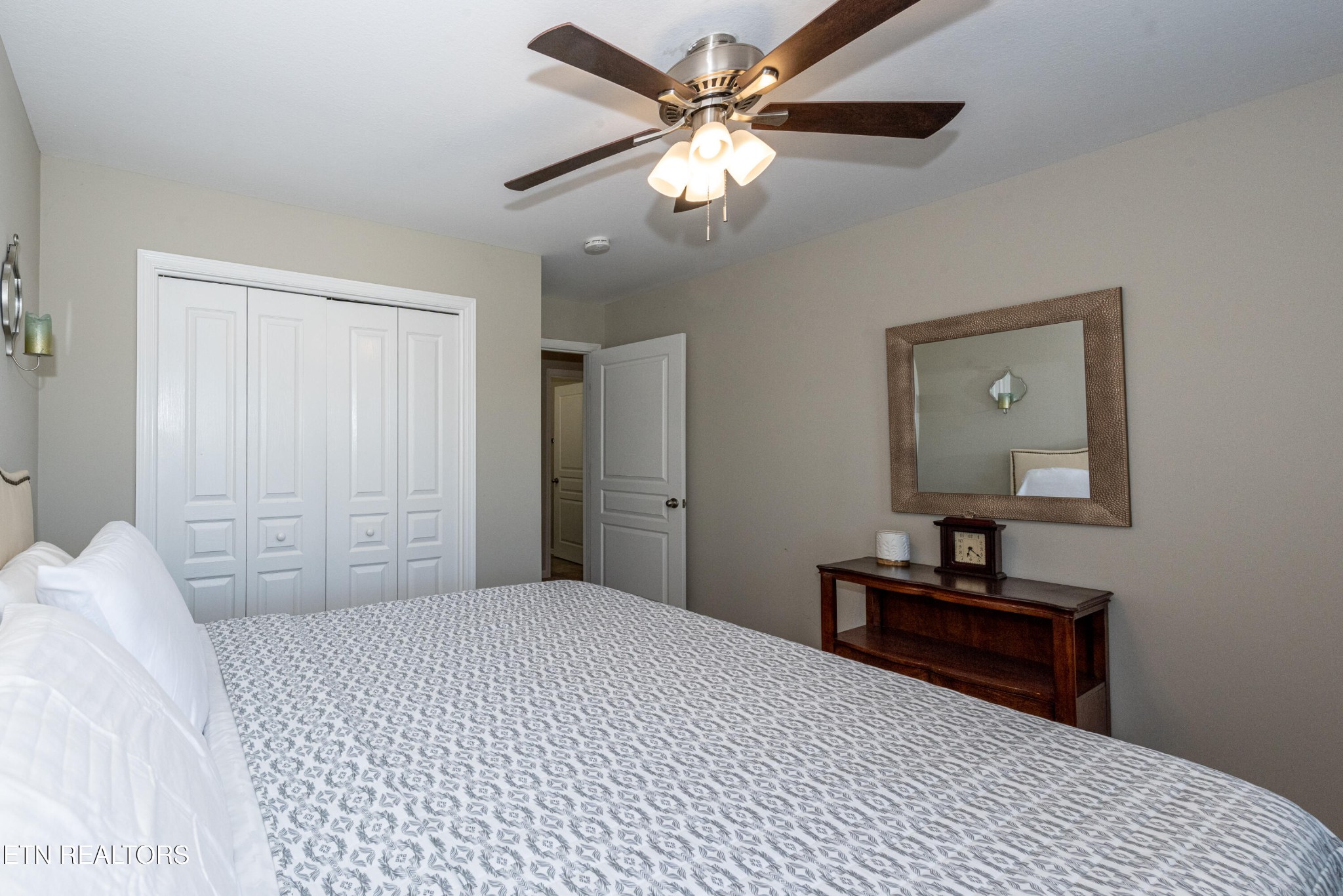 1600 Legacy Park Road Knoxville, TN 37922 - Photo 38 of 58 a bedroom with a large bed and a chandelier