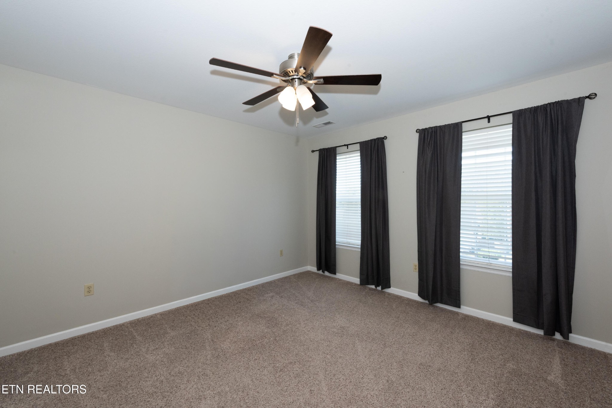 1600 Legacy Park Road Knoxville, TN 37922 - Photo 40 of 58 an empty room with windows and fan