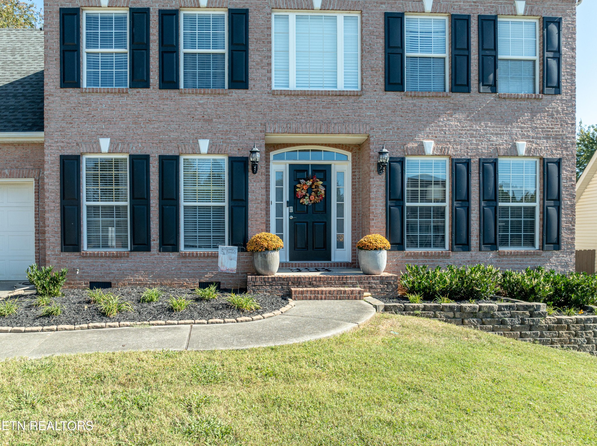 1600 Legacy Park Road Knoxville, TN 37922 - Photo 56 of 58 a front view of a house with a yard and porch