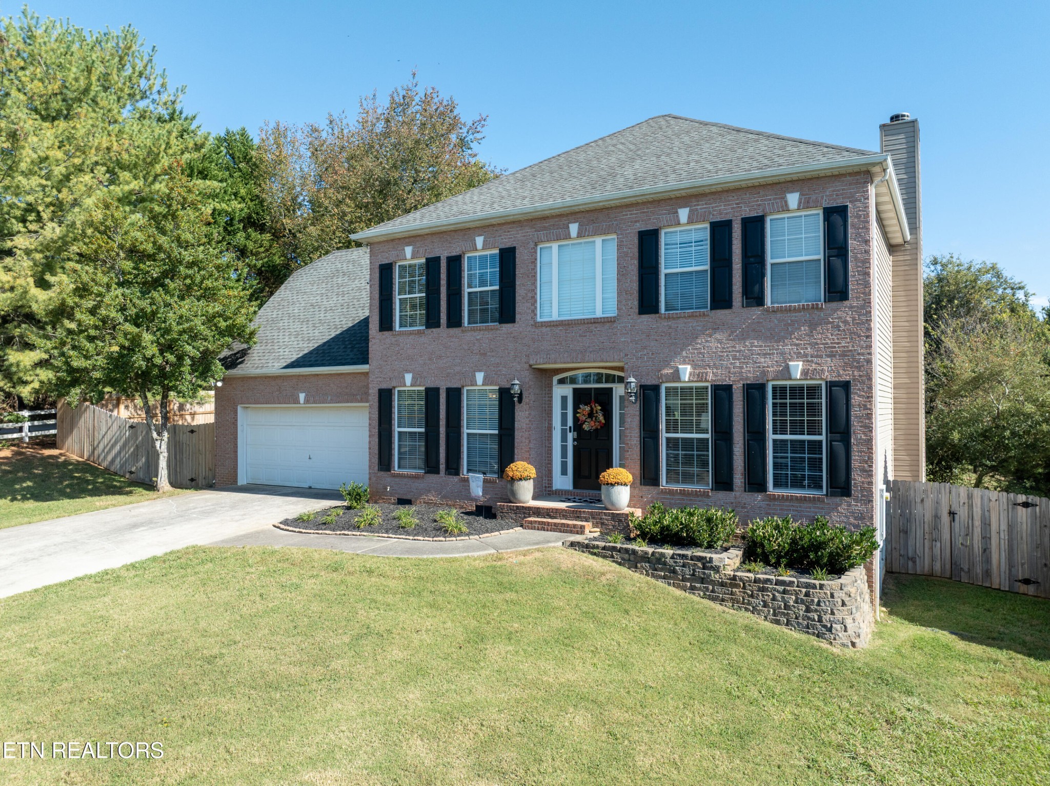 1600 Legacy Park Road Knoxville, TN 37922 - Photo 57 of 58 a front view of a house with yard and trees in the background