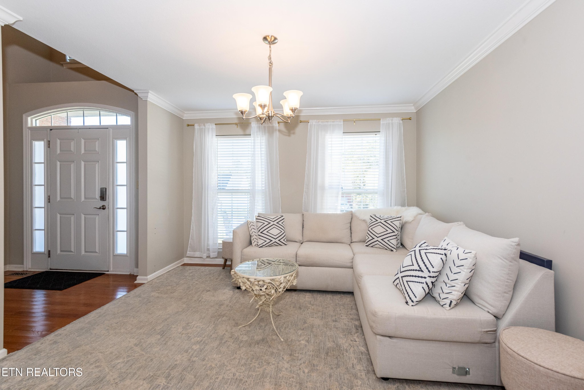 1600 Legacy Park Road Knoxville, TN 37922 - Photo 7 of 58 a living room with furniture and a chandelier