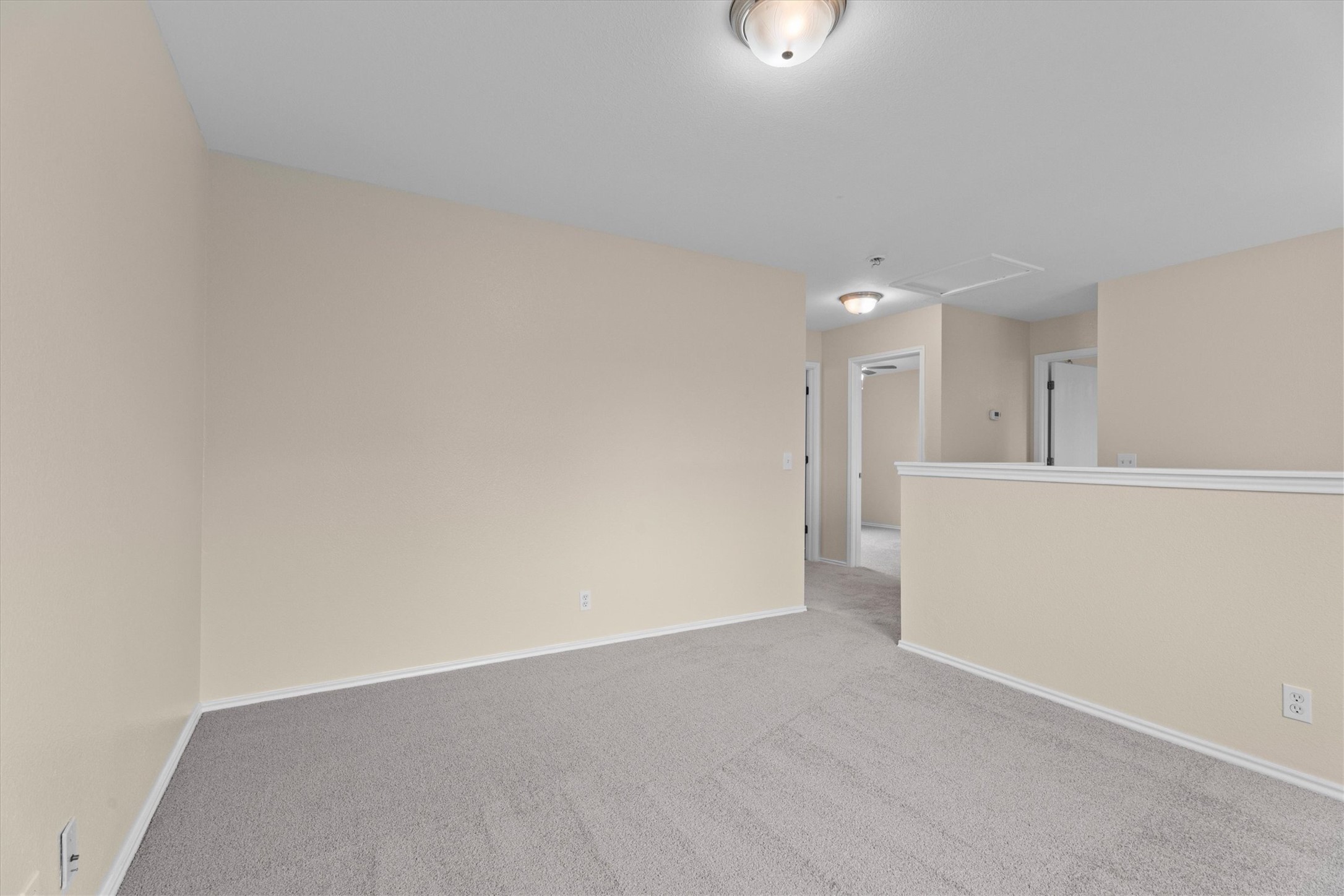 172 Discovery Kyle, TX 78640 - Photo 11 of 21 Versatile upstairs living space with soft carpet and an open layout ideal for a game room, office, or additional lounge area