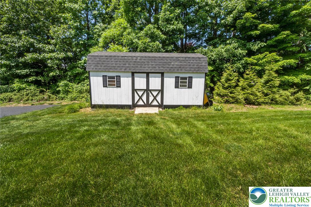 9461 Red Road Kempton, PA 19529 - Photo 51 of 55 A storage shed offers utility and storage for the gardening tools.