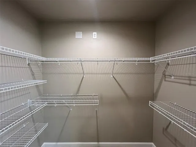 a view of a room with racks on the wall