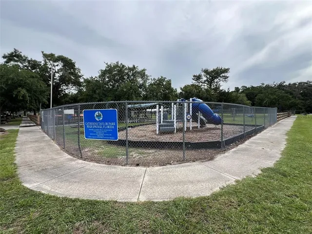 swimming pool view with a seating space