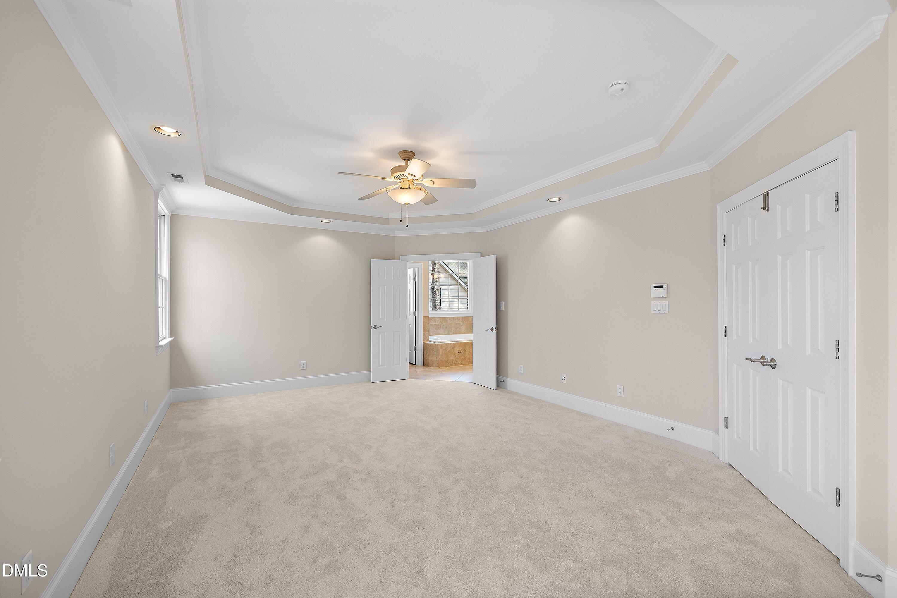 1525 Eglantyne Court Raleigh, NC 27613 - Photo 37 of 105 a view of an empty room with a chandelier fan