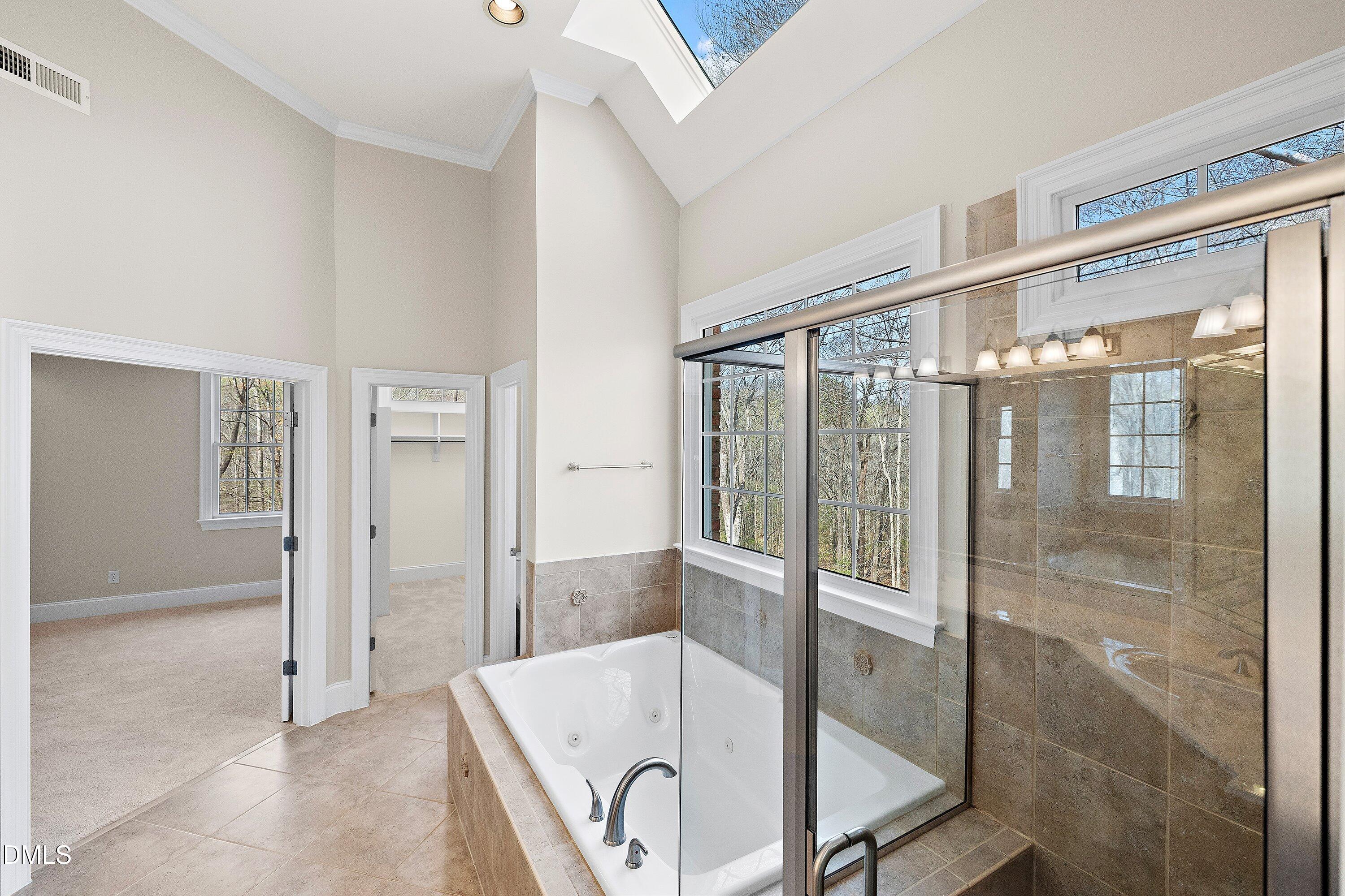 1525 Eglantyne Court Raleigh, NC 27613 - Photo 42 of 105 a bathroom with a tub and shower