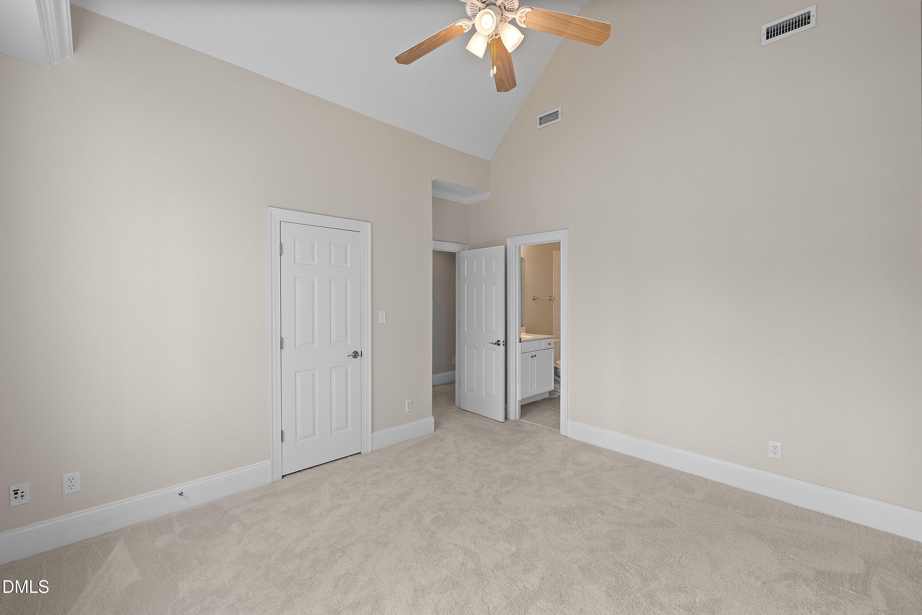 1525 Eglantyne Court Raleigh, NC 27613 - Photo 49 of 105 an empty room with a chandelier fan