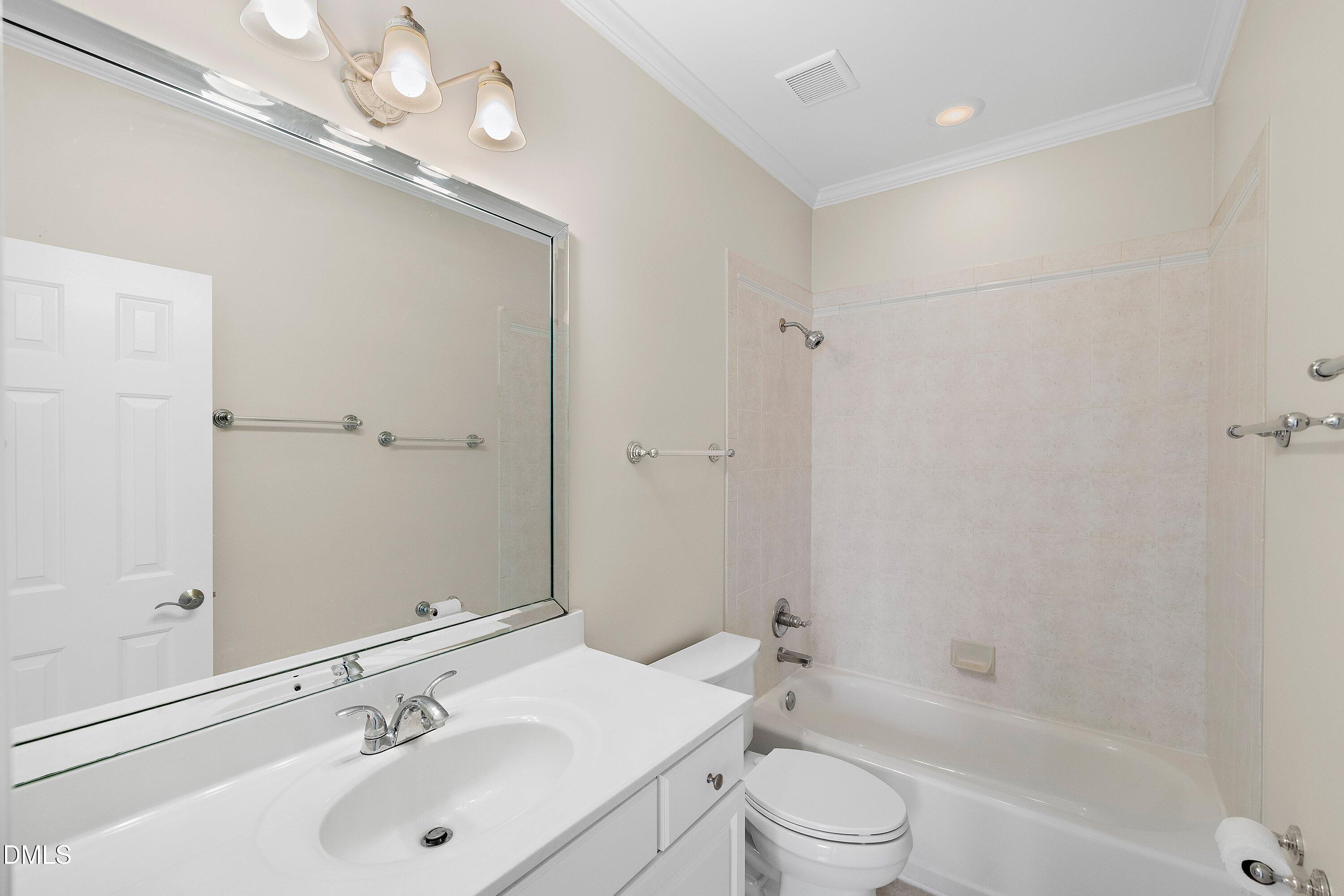 1525 Eglantyne Court Raleigh, NC 27613 - Photo 50 of 105 a bathroom with a sink a toilet and shower