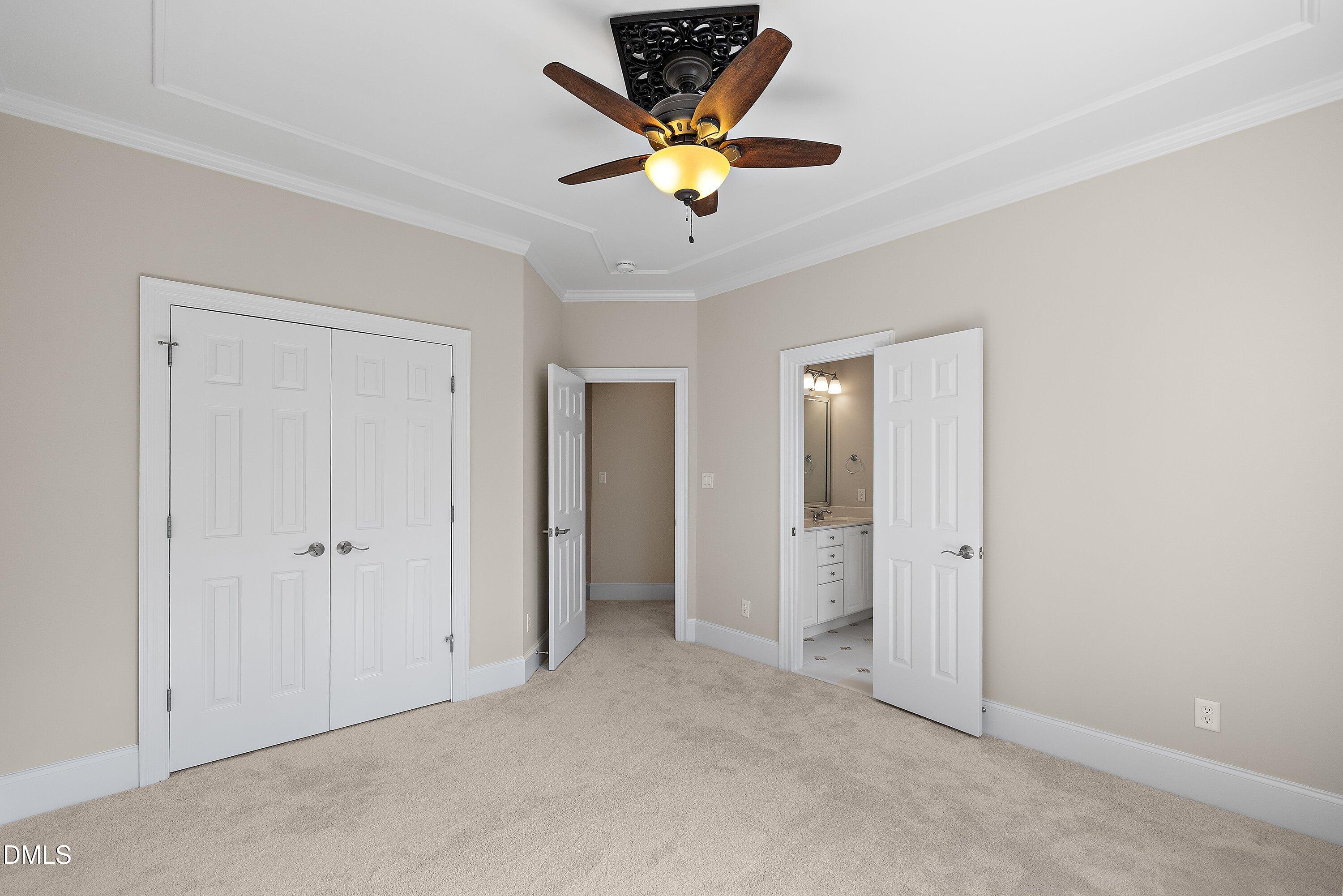 1525 Eglantyne Court Raleigh, NC 27613 - Photo 52 of 105 an empty room with closet and a chandelier fan